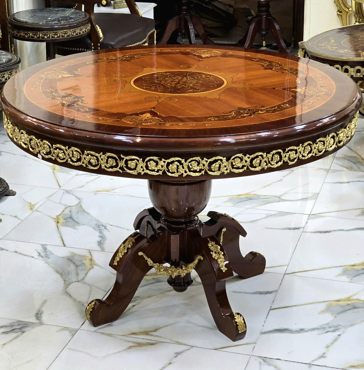 Grand French-Style Round Dining Table – Rich Wood Finish with Ornate Gold Leaf Details