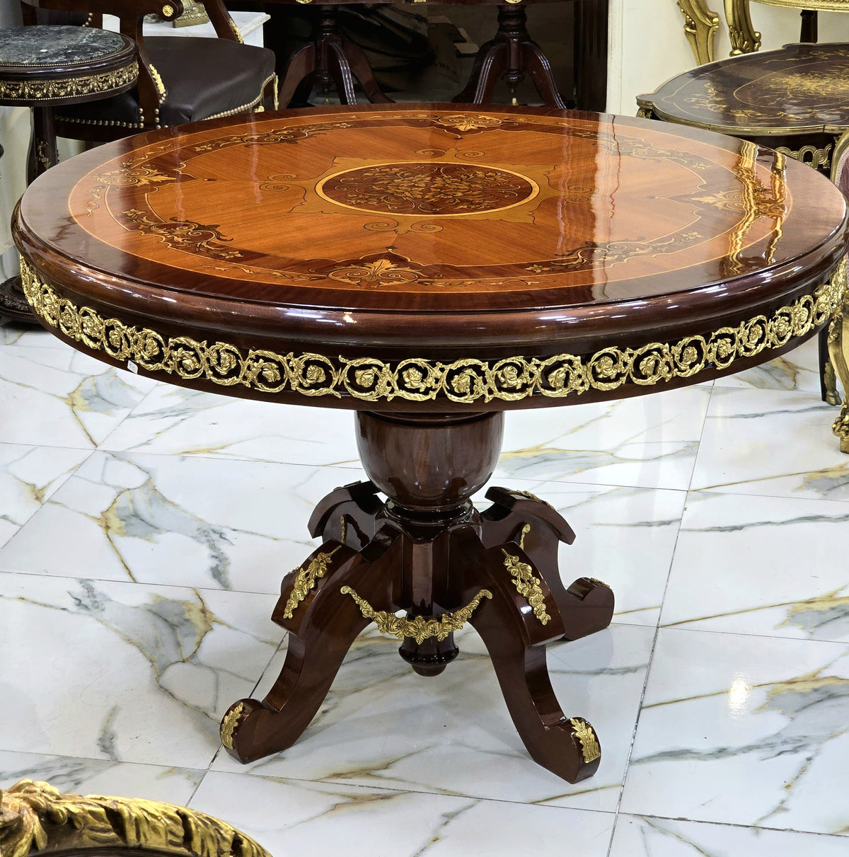 Grand French-Style Round Dining Table – Rich Wood Finish with Ornate Gold Leaf Details