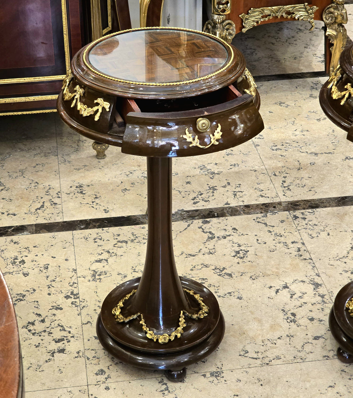 French Neoclassical Side Table – Dark Wood, Glass Top, Gold Leaf & Small Drawer