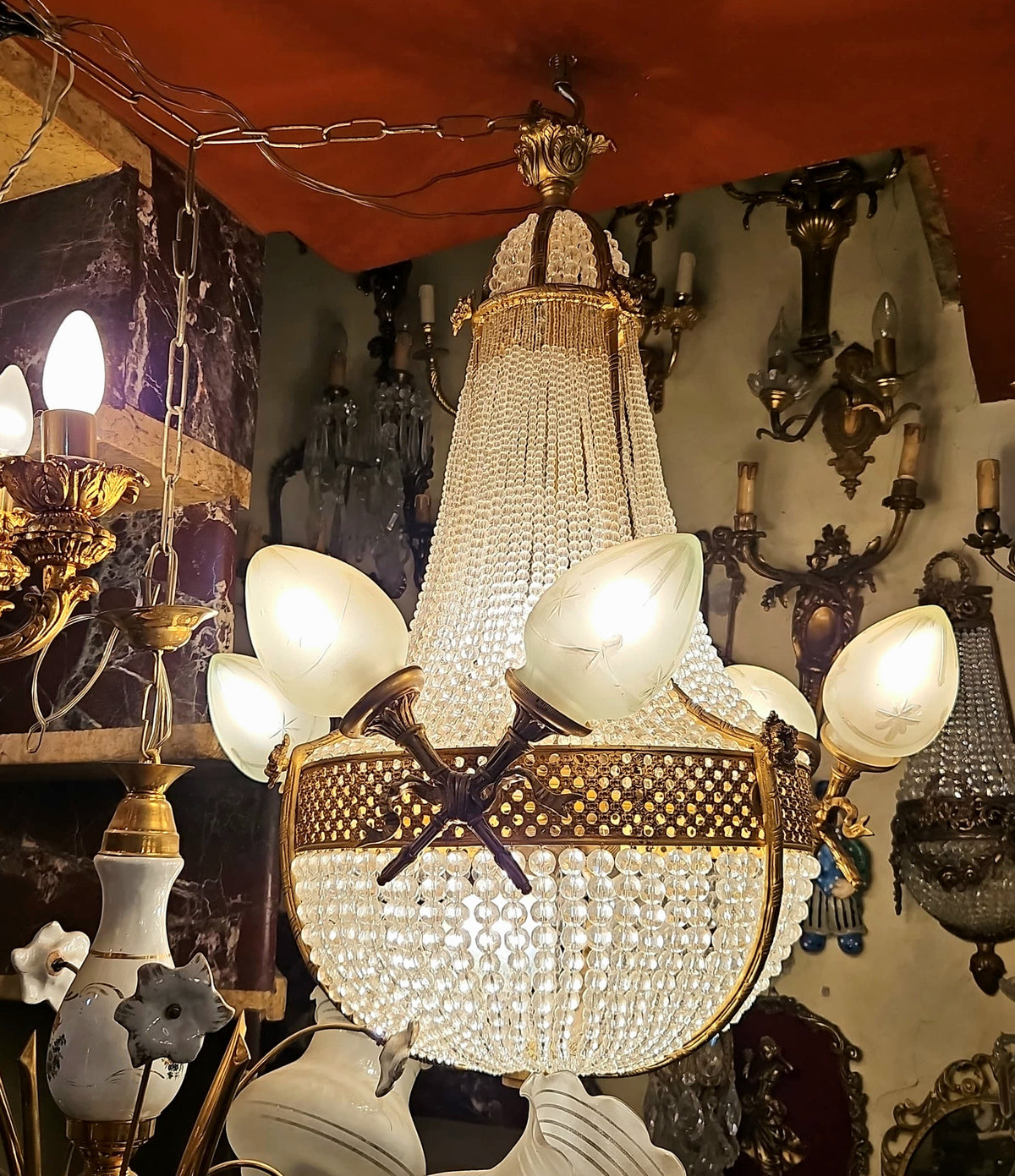 Grand French-Style Crystal Chandelier – Gilded Bronze Frame, Gold Leaf Details & Sculptural Crossed Accents