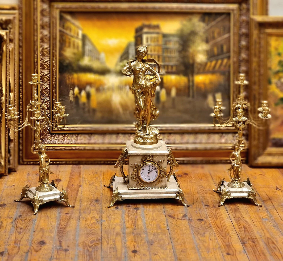 French Neoclassical Marble Clock and Candelabra Set with Gilded Bronze Figures and Gold Leaf Details