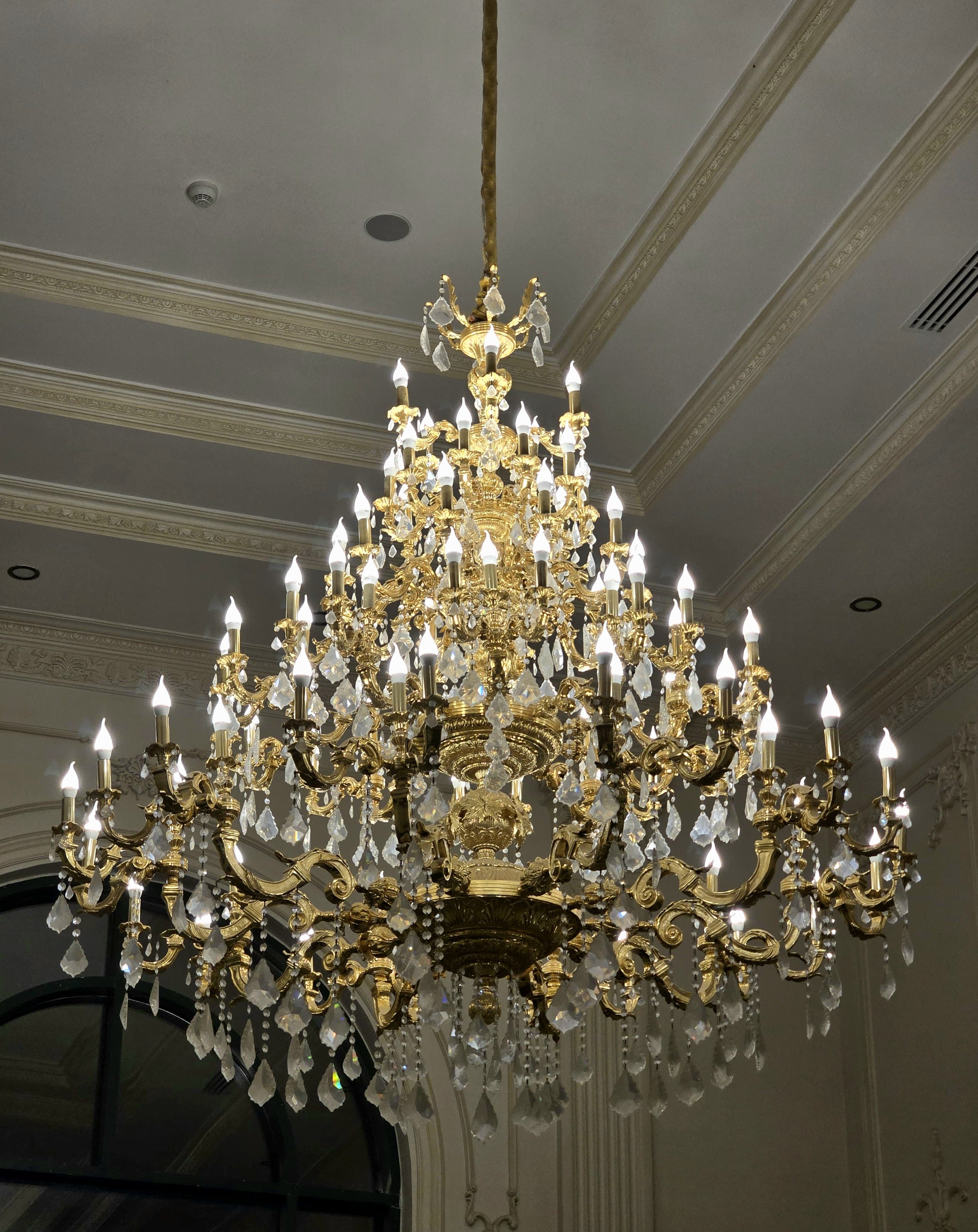 Monumental French Crystal Chandelier with Gold Leaf & Ornate Bronze Details