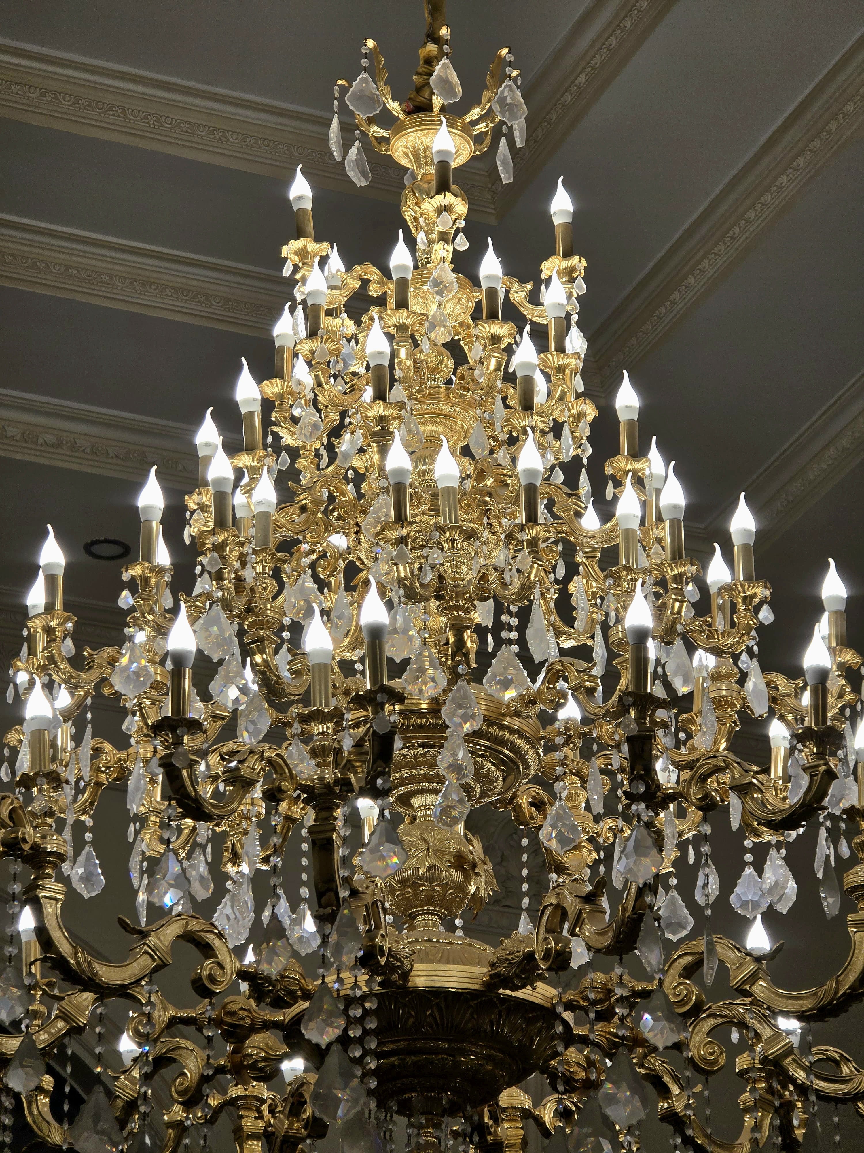 Monumental French Crystal Chandelier with Gold Leaf & Ornate Bronze Details