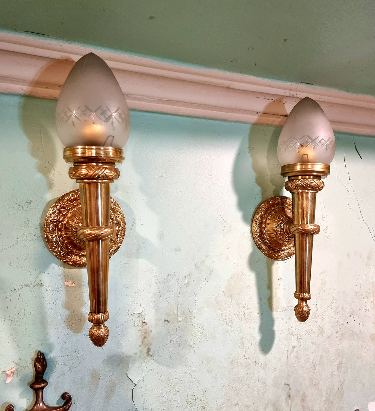 Gold Leaf Wall Sconce Pair with Ornate Round Backplates, Fluted Columns and Decorative Candle-Style Glass Shades