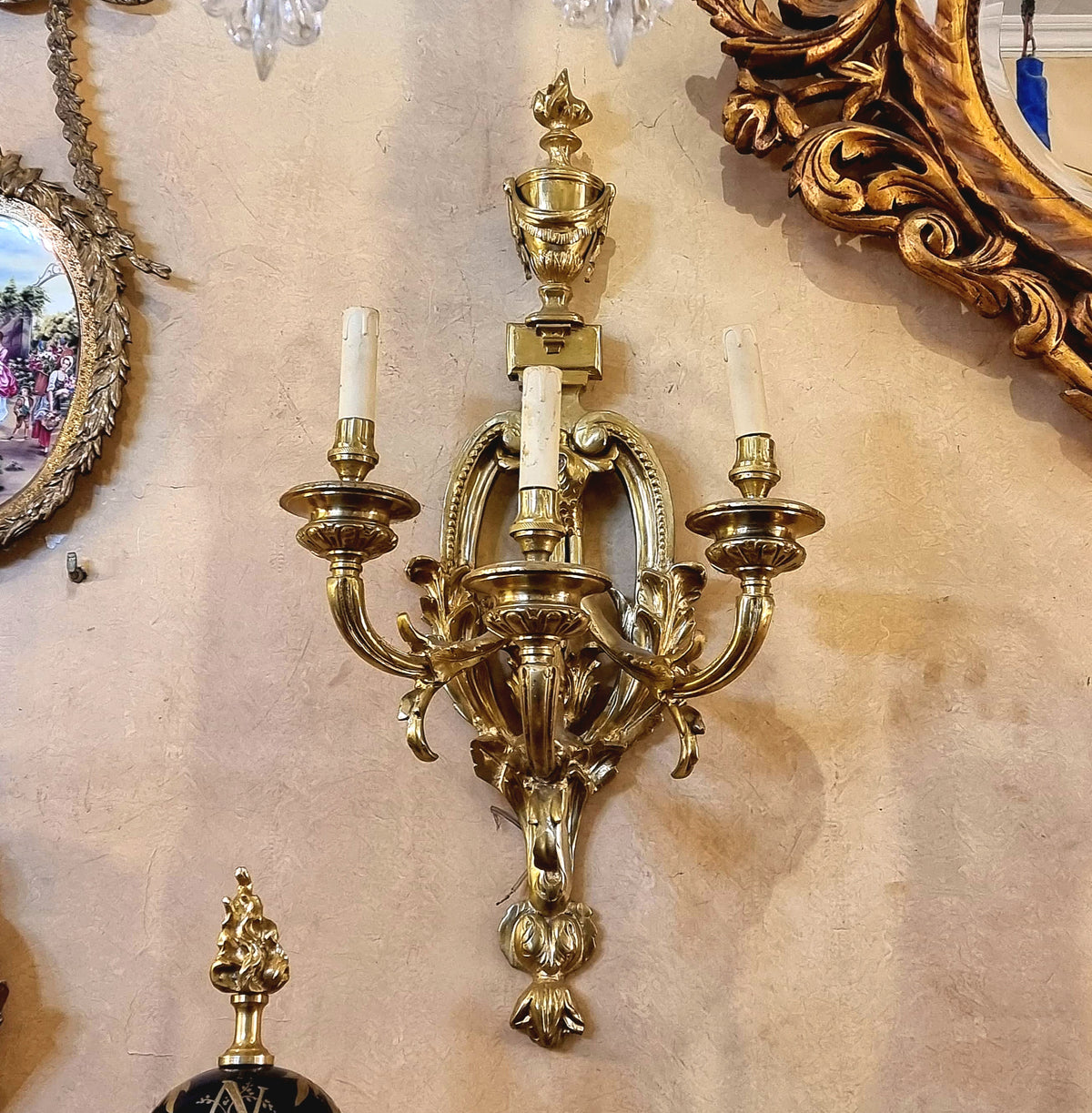 French Louis XV Style Five-Light Gilded Bronze Wall Sconce with Elaborate Foliate Scrollwork and Ornate Gold Leaf Details