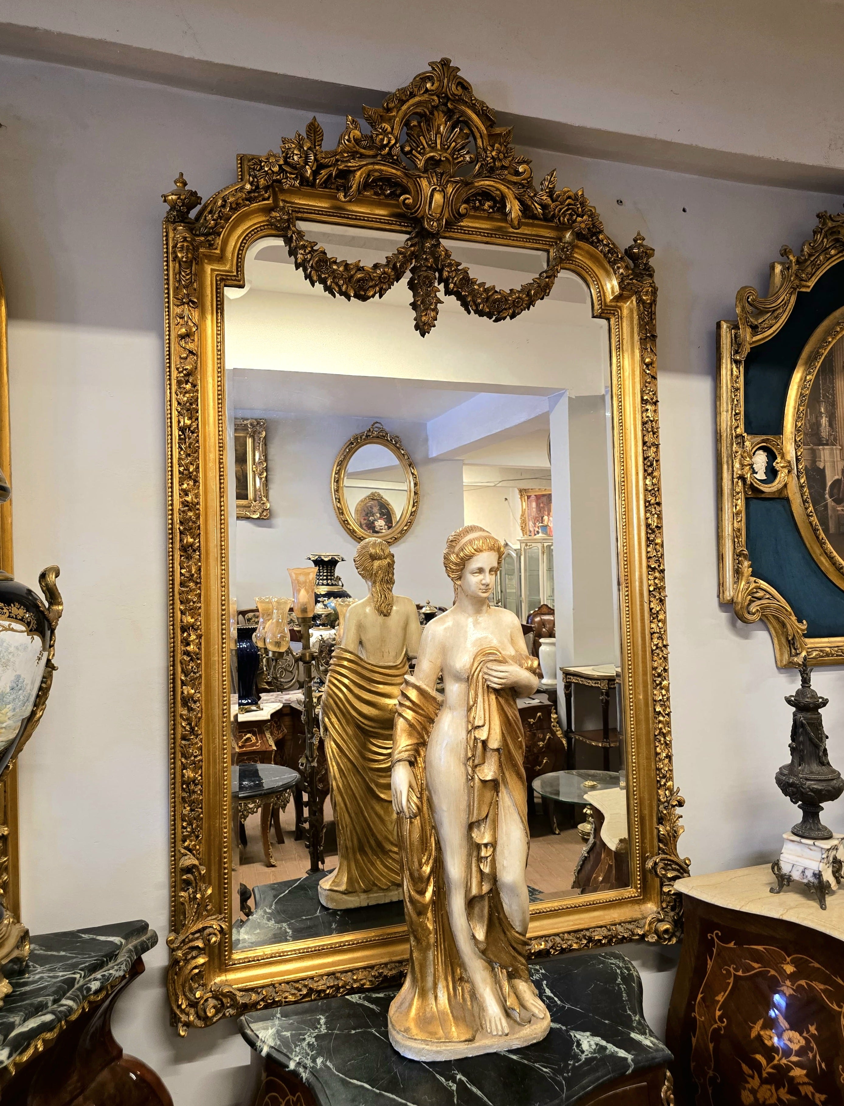 French Louis XV Gold Leaf Mirror with Ornate Floral Crest & Handcrafted Decorative Frame