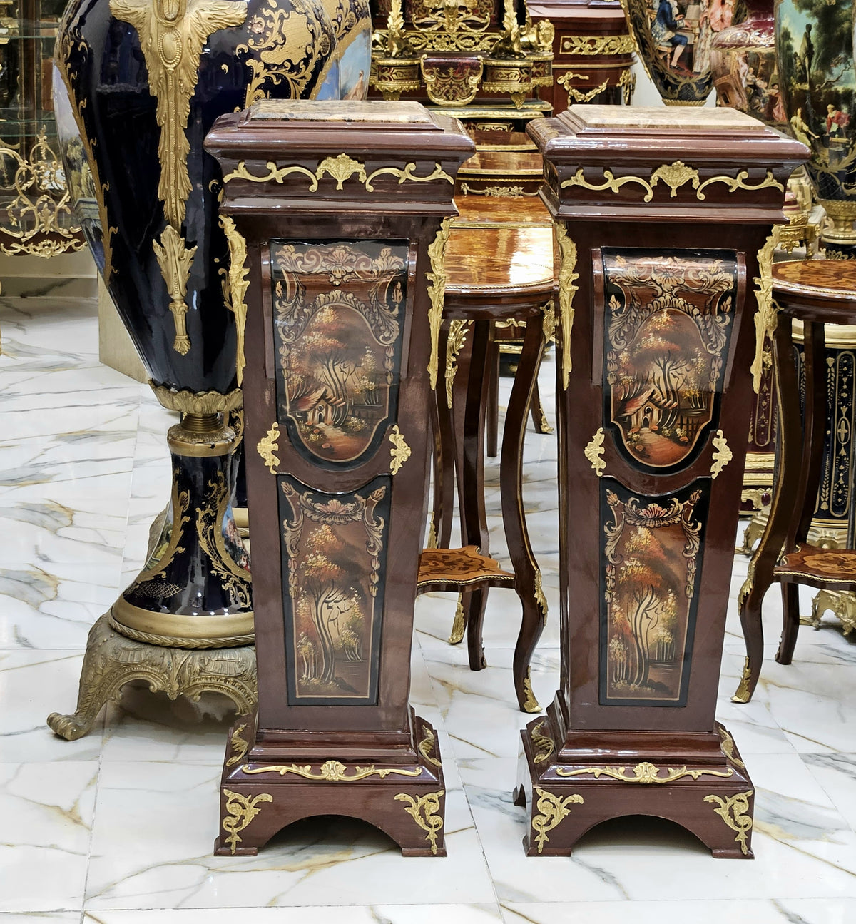 The Gilded Duo – Ornate Wooden Pedestal Pair with Scenic Artwork & Marble Tops