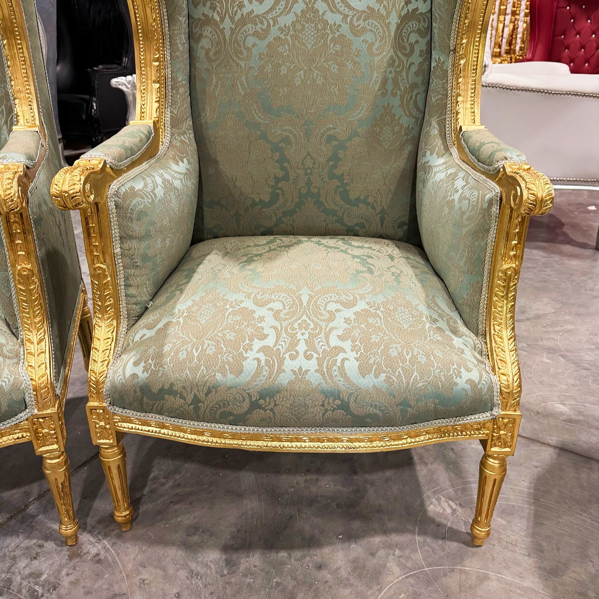 French Louis XV Style Green Bergère Wing Chair with Gold Leaf Details