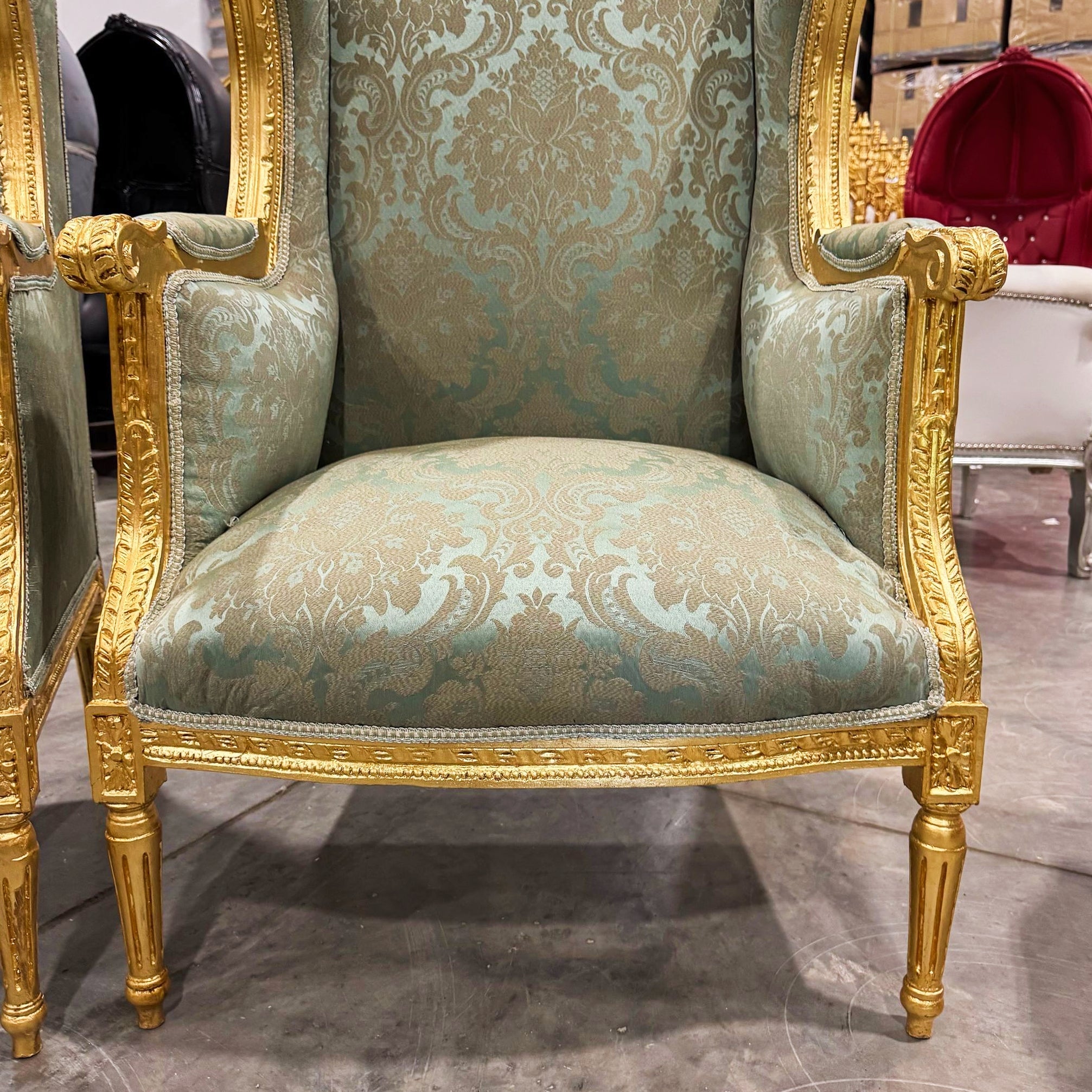 French Louis XV Style Green Bergère Wing Chair with Gold Leaf Details