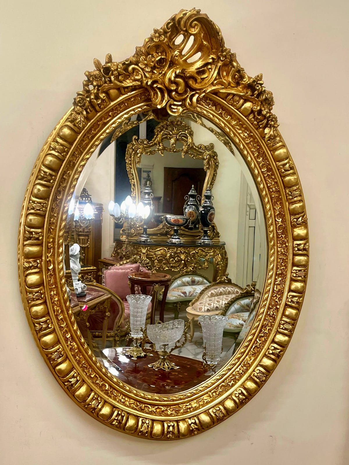 Italian Oval Wall Mirror with Floral Center Detail & Gold Leaf Frame