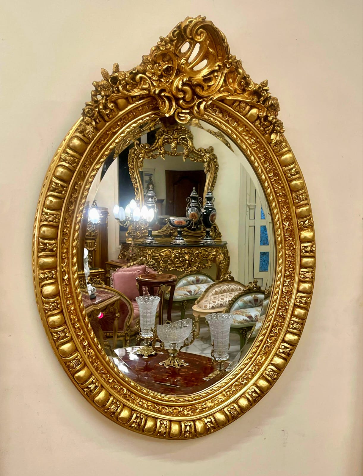 Italian Oval Wall Mirror with Floral Center Detail & Gold Leaf Frame