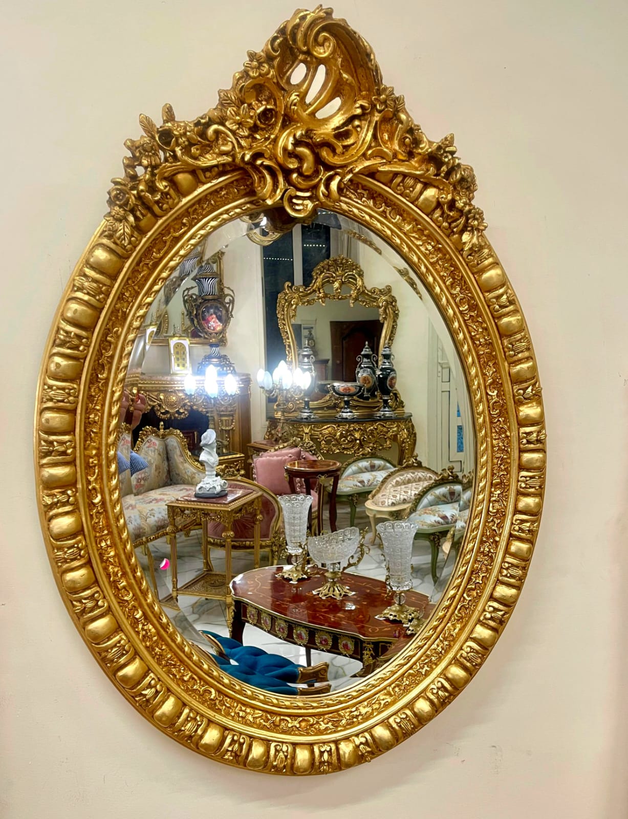 Italian Oval Wall Mirror with Floral Center Detail & Gold Leaf Frame