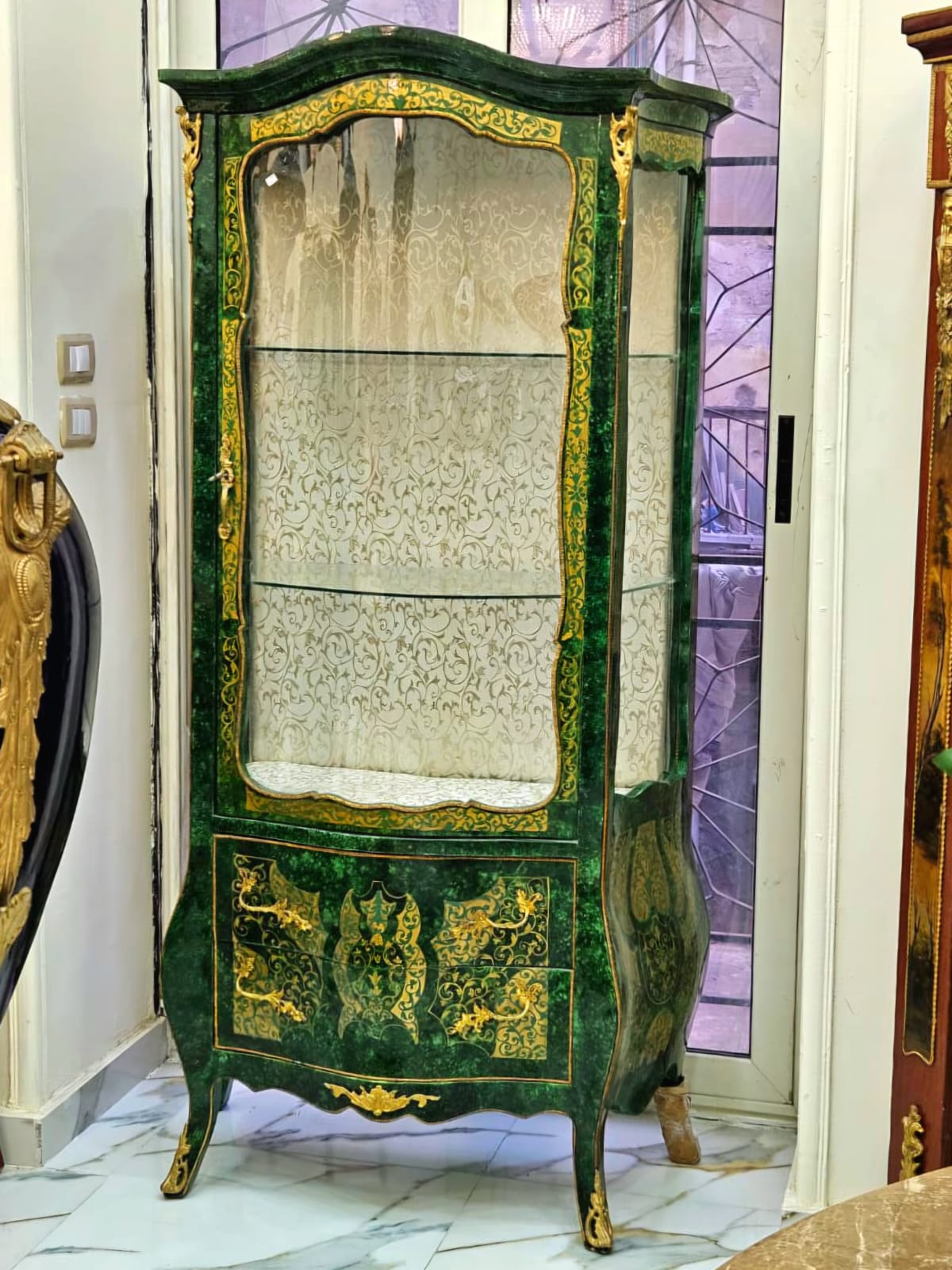 Emerald Green Curio Cabinet with Gold Leaf Accents, Glass Display Shelves & Bombe Base