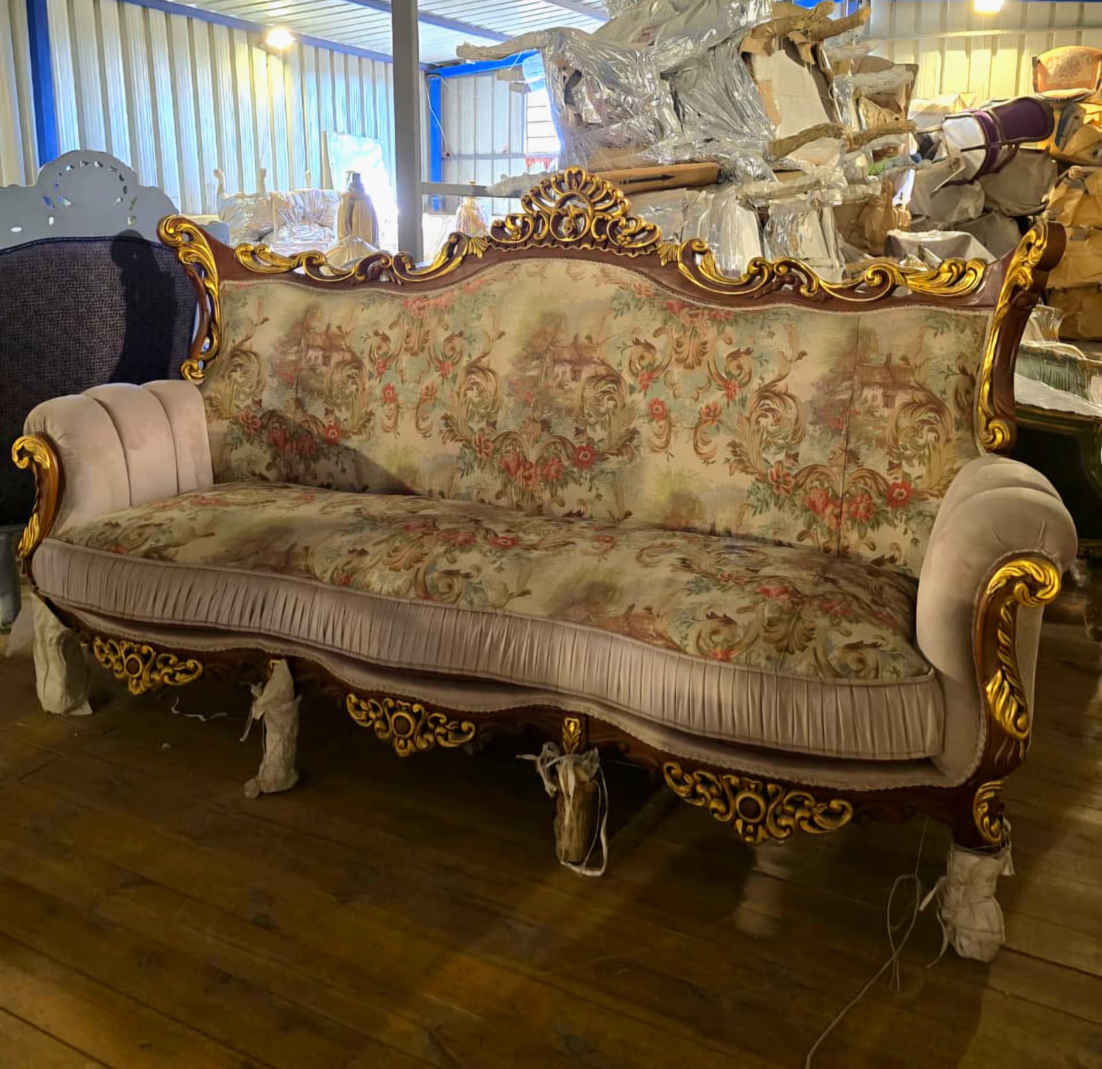 French Rococo Three-Seat Sofa with Floral Upholstery & Ornate Gold Leaf Carvings