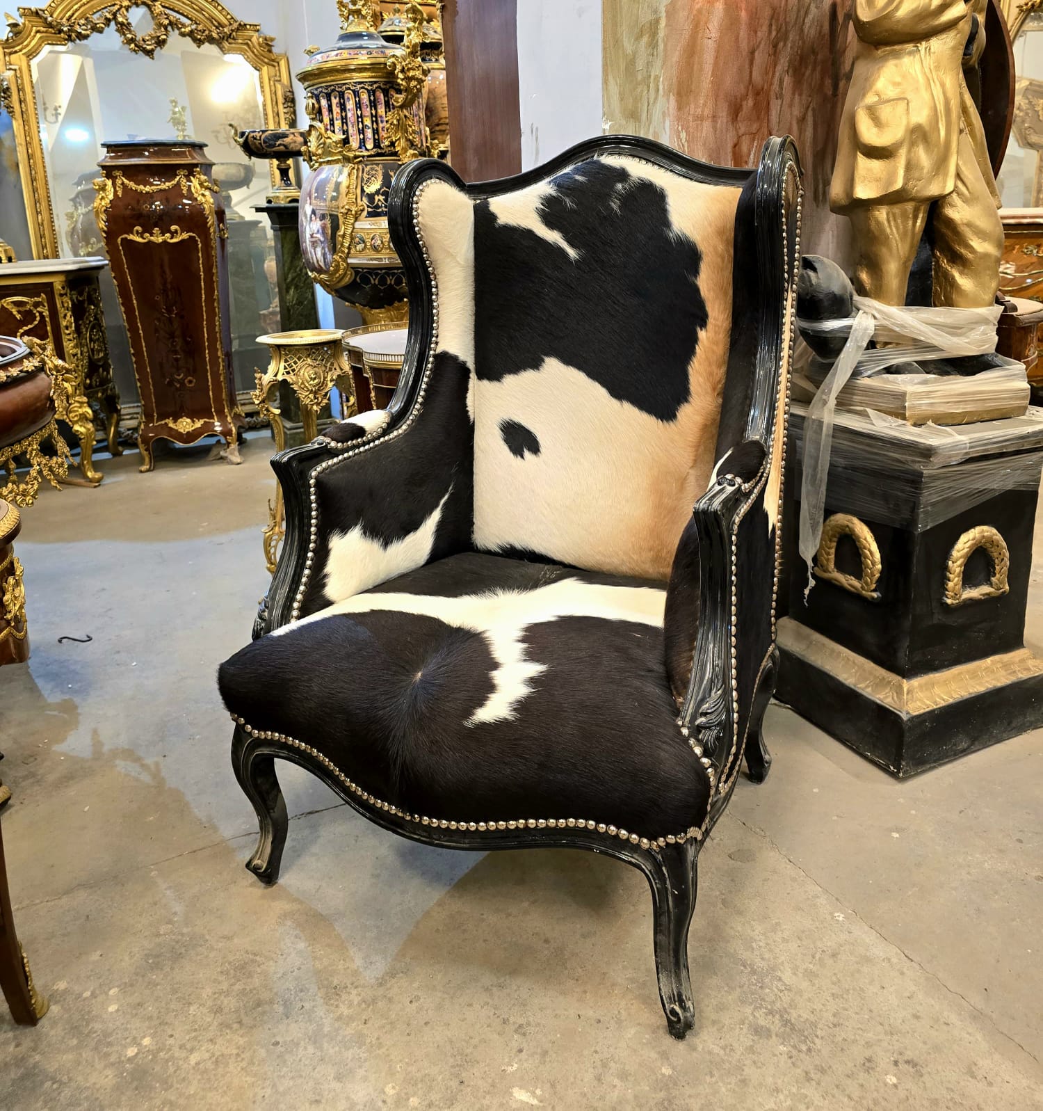 Black Cowhide Wingback Armchair with Handcrafted Black Wood Frame