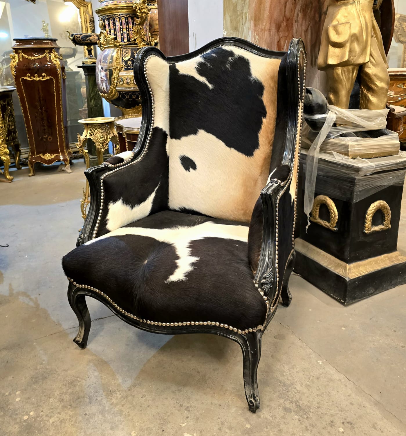 Black Cowhide Wingback Armchair with Handcrafted Black Wood Frame