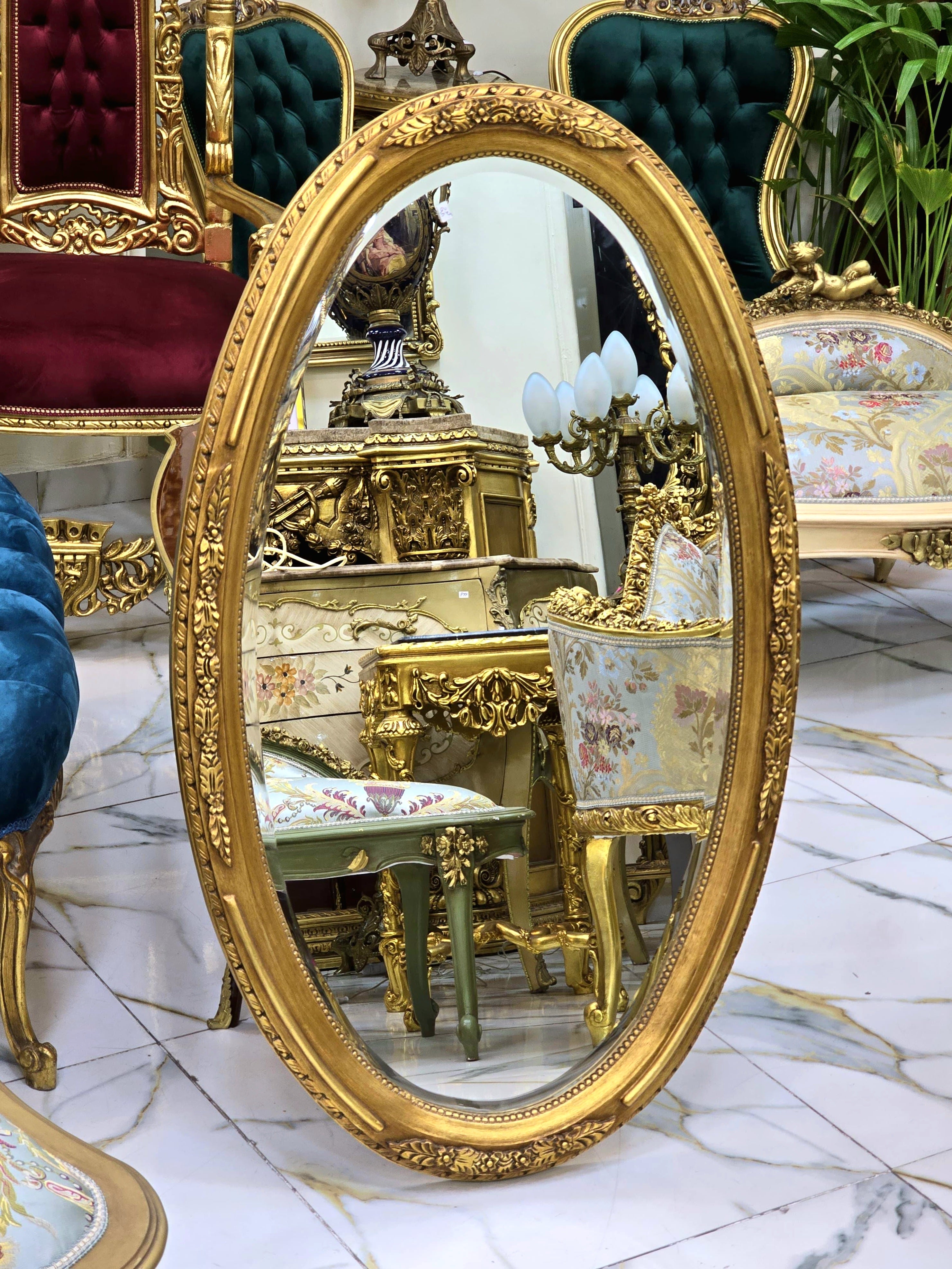French Oval Wall Mirror with Floral Center Detail & Gold Leaf Frame