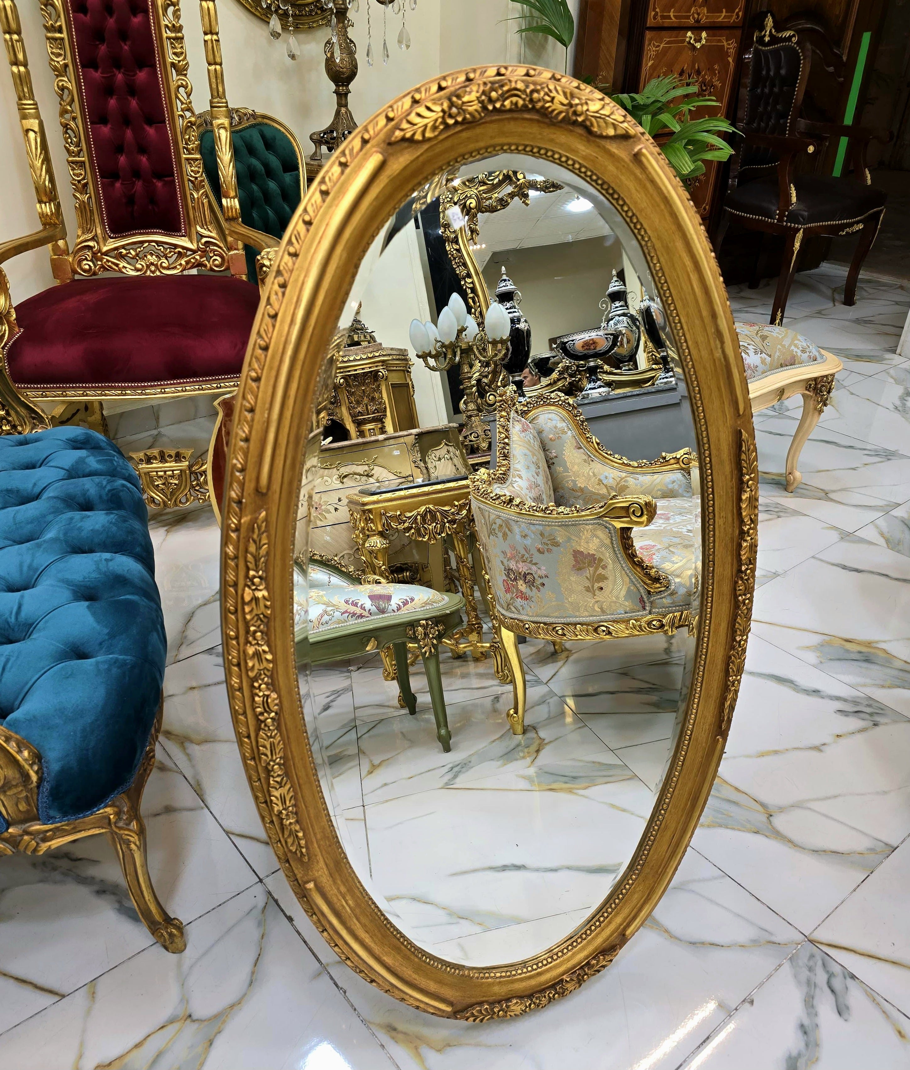 French Oval Wall Mirror with Floral Center Detail & Gold Leaf Frame