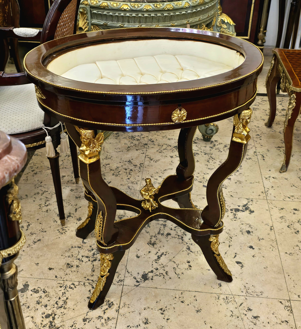 French-Style Oval Side Table – Glass Top, Rich Wood Finish & Ornate Gold Leaf Details