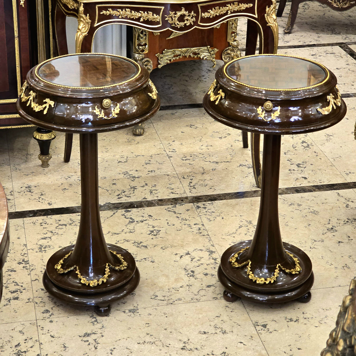 Set of 2 French Neoclassical Side Tables – Dark Wood, Glass Tops & Gold Leaf Details