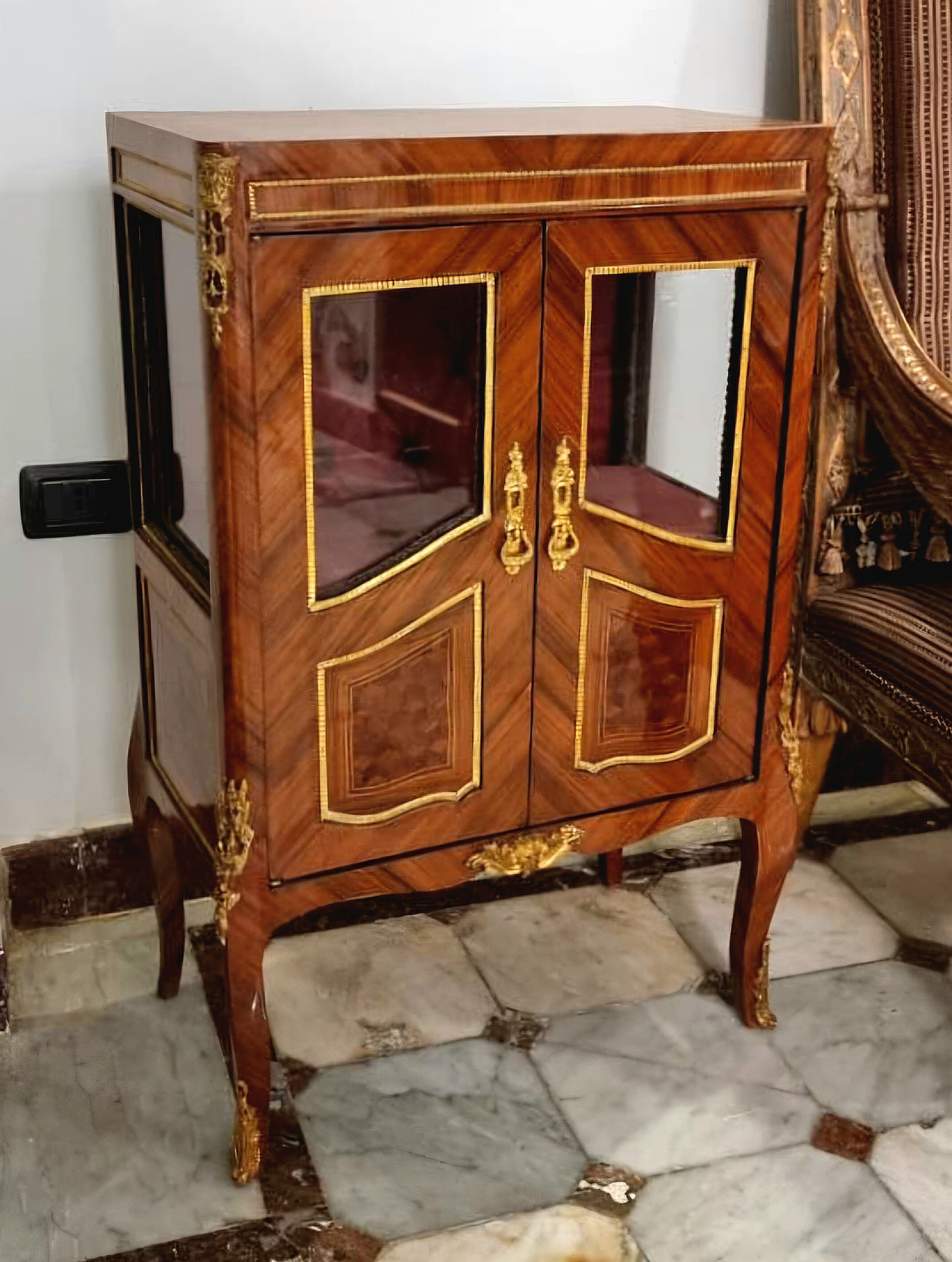 French Louis XVI Style Display Cabinet – Rich Wood Marquetry with Gilded Bronze Accents & Mirrored Doors