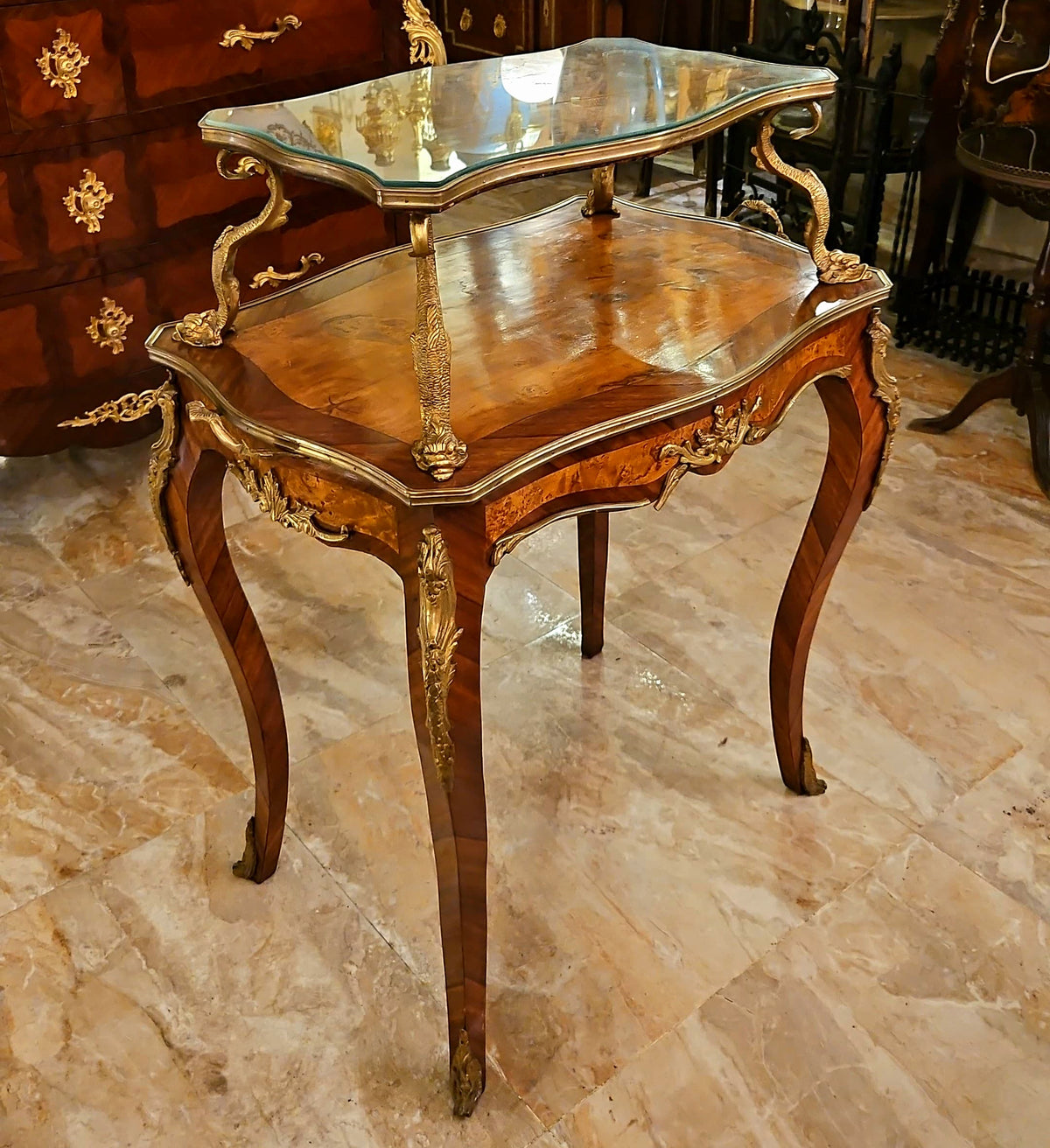 French-Style Serving Table – Rich Wood Finish, Glass Top & Ornate Gold Leaf Details