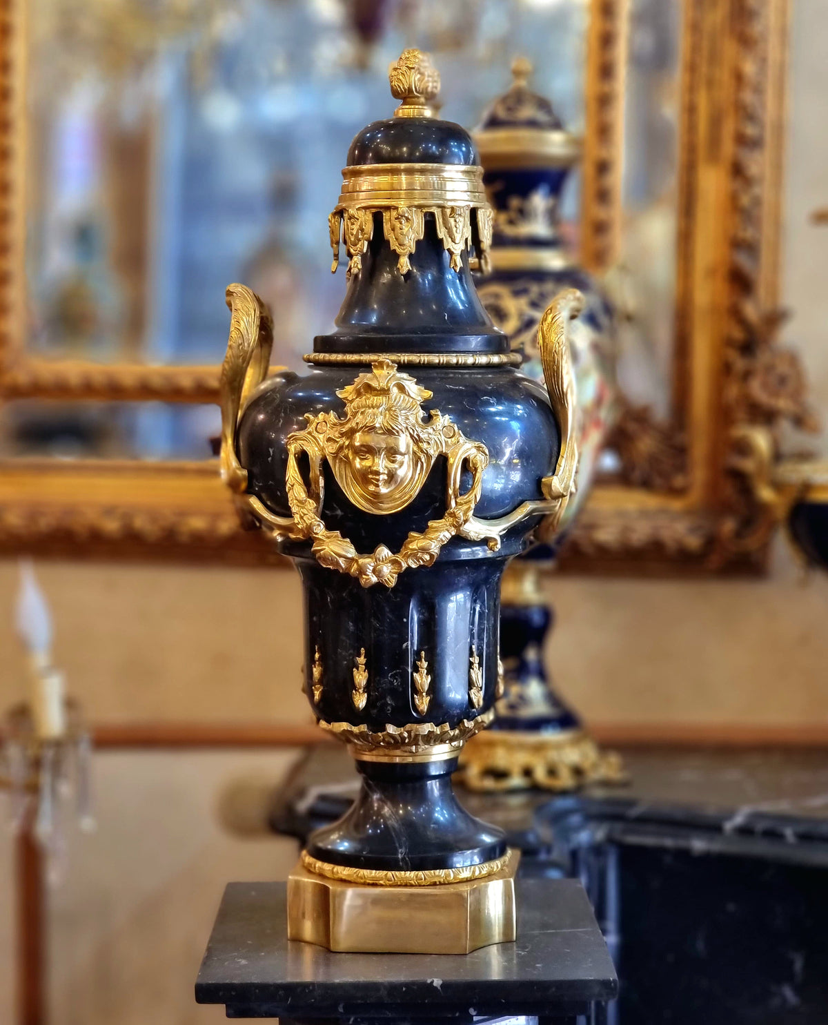 French Empire Style Black Porcelain Urn with Gilded Bronze Mounts, Gold Leaf Details and Classical Mask Motif