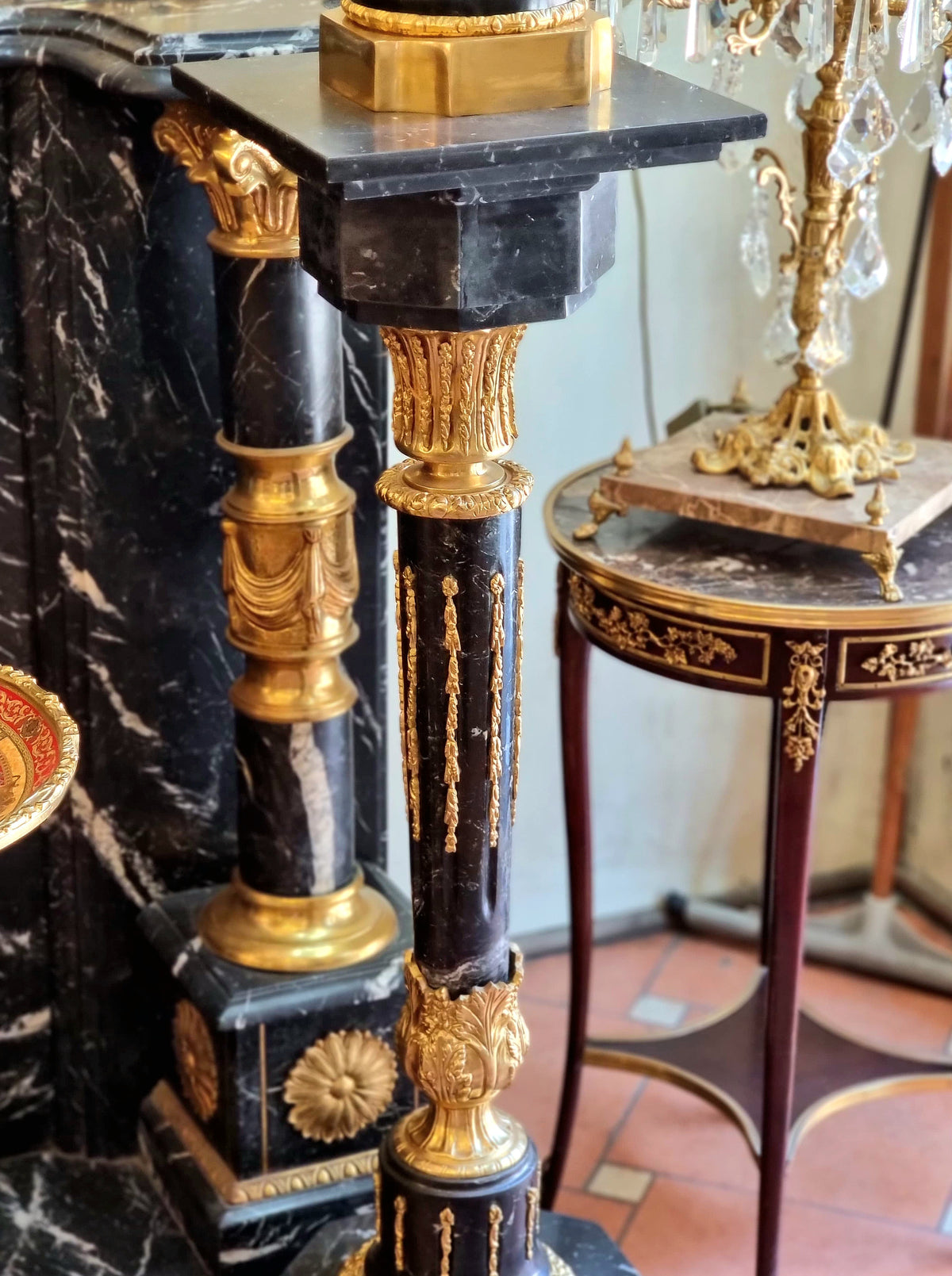 French Empire Style Black Marble Pedestal with Porcelain Urn, Bronze Mounts, Gold Leaf and Sculpted Details