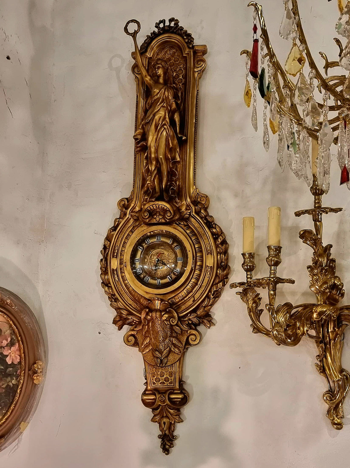 French Rococo Style Gilded Bronze Wall Clock with Sculptural Female Figure, Gold Leaf and Elaborate Foliate Details