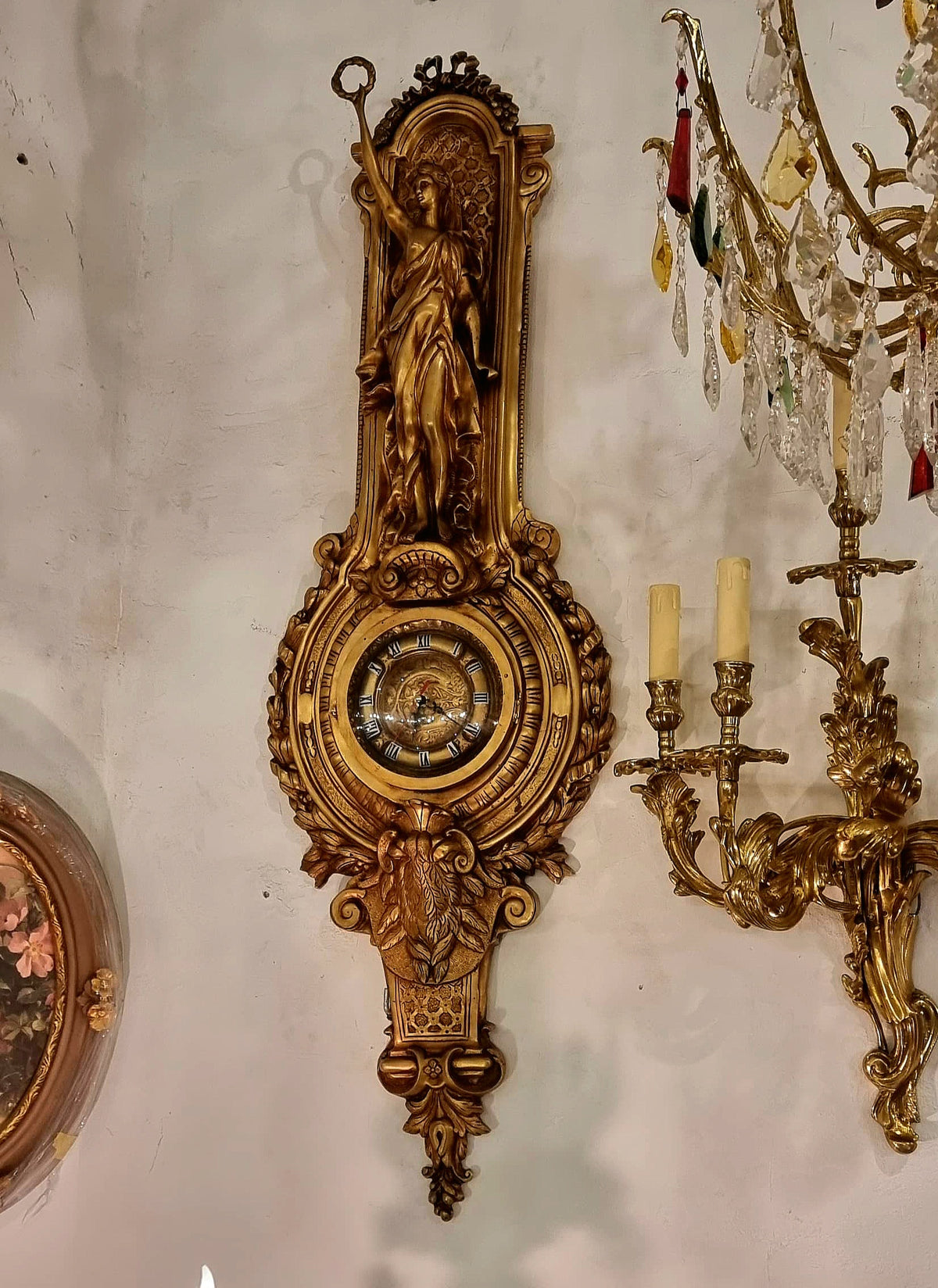 French Rococo Style Gilded Bronze Wall Clock with Sculptural Female Figure, Gold Leaf and Elaborate Foliate Details