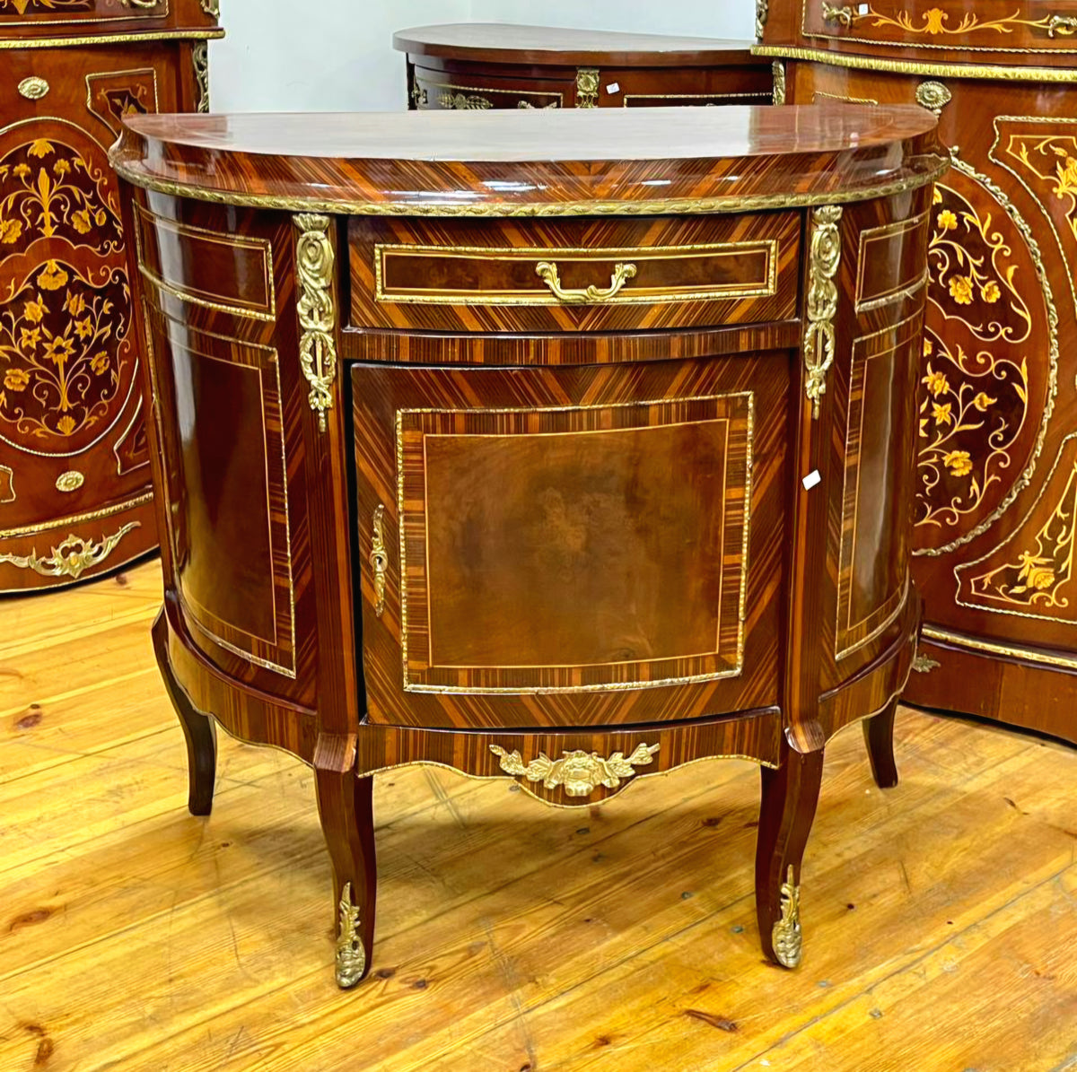 Ornate French Demilune Cabinet – Rich Hardwood Finish with Gold Leaf Ornamentation