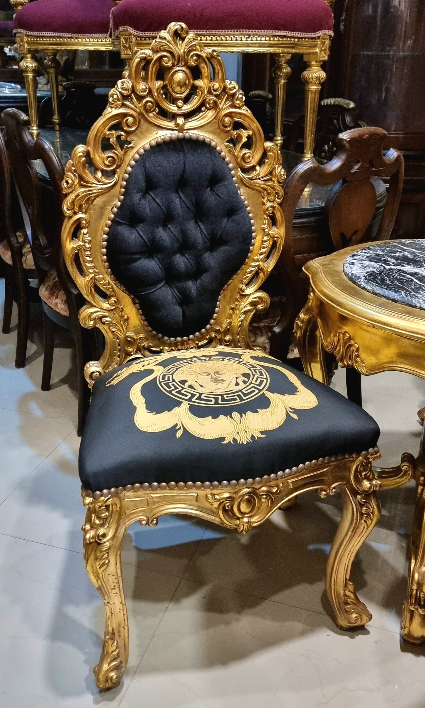 Regal French Baroque Style Accent Chair – Gold Leaf Carved Frame with Black Tufted Upholstery & Medallion Detail