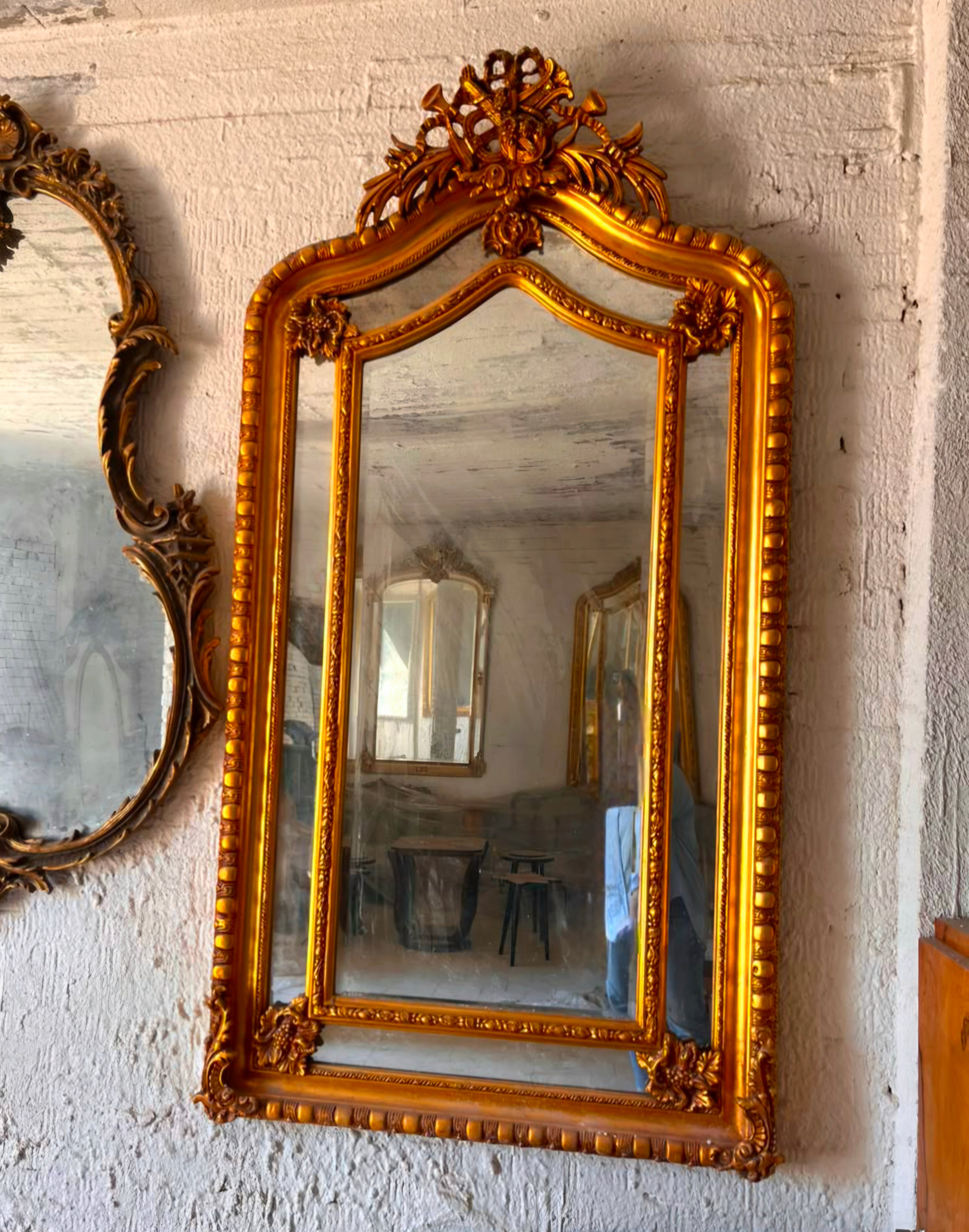 French Rococo Gold Leaf Wall Mirror with Ornate Floral Crest & Carved Decorative Frame