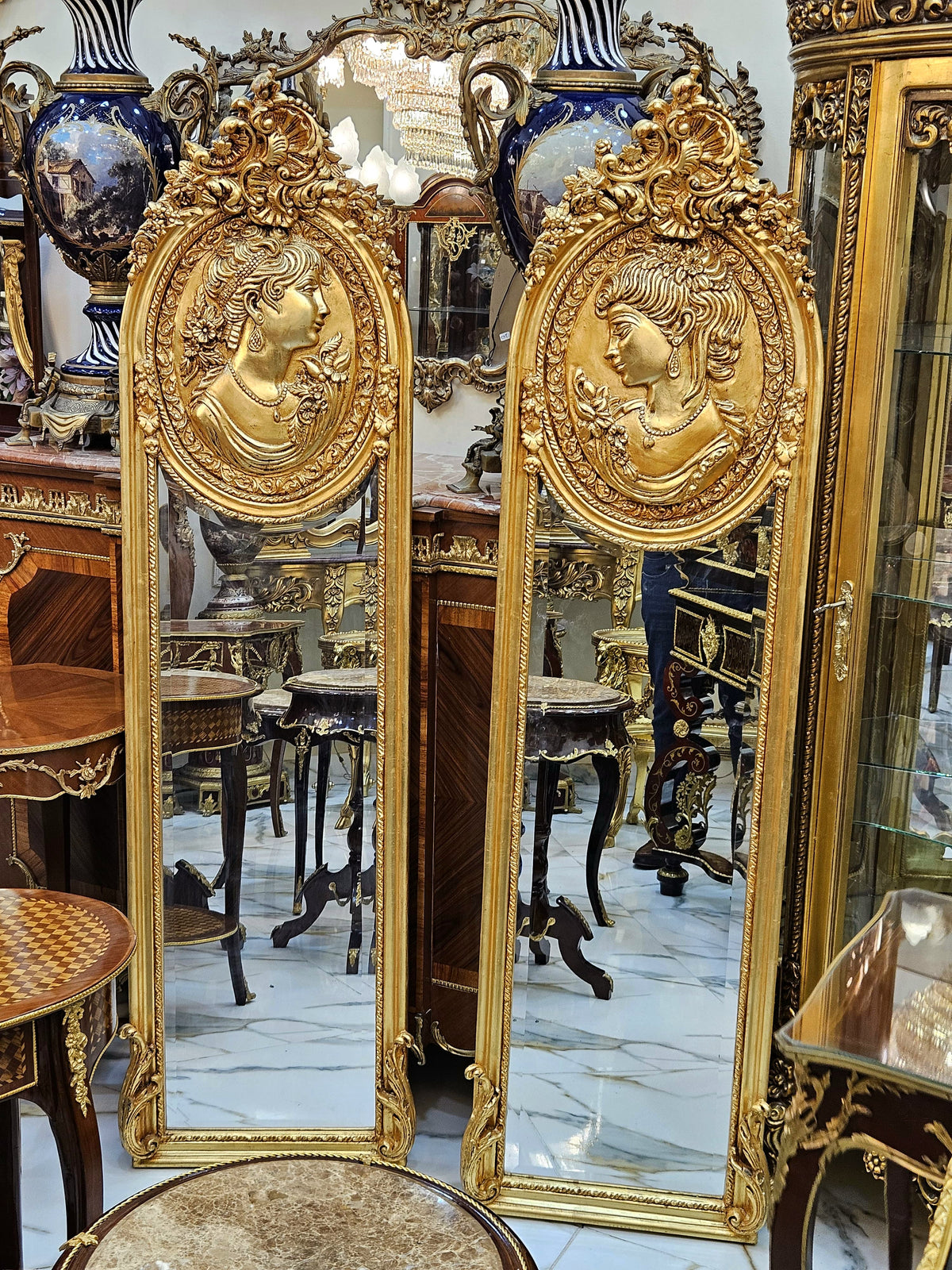The Gilded Visages – Pair of French Baroque Mirrors with Sculpted Female Faces & Ornate Gold Leaf Frames