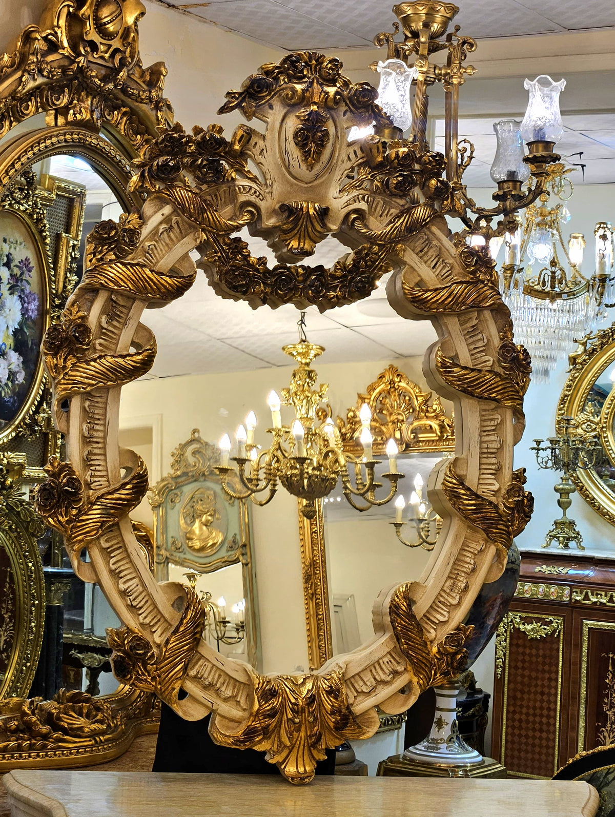 French Baroque Oval Mirror – Handcrafted Floral Gilt Frame with Sculptural Gold Leaf Ornamentation