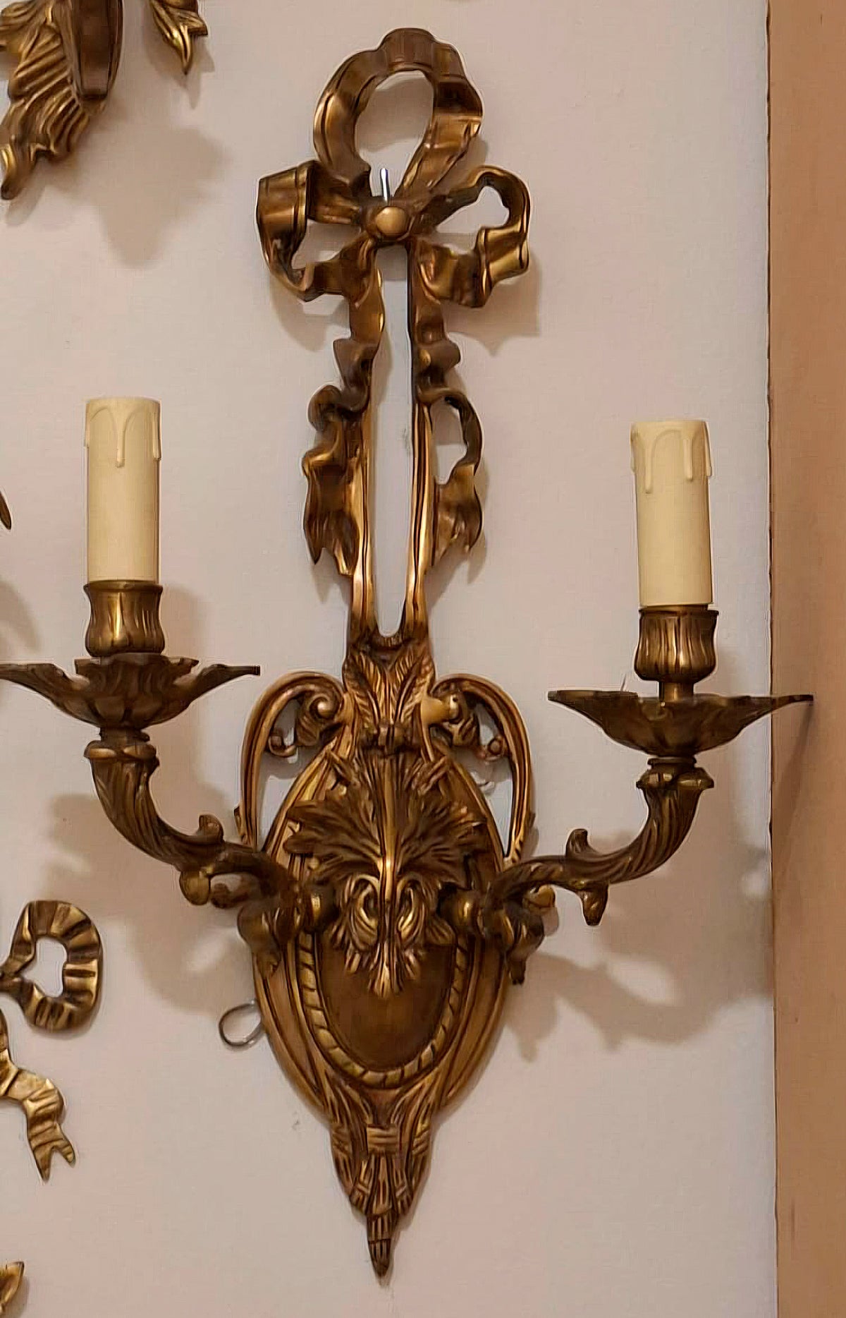 French Louis XVI-Inspired Two-Light Wall Sconce – Ornate Gold Leaf Bronze & Sculpted Bow Detail