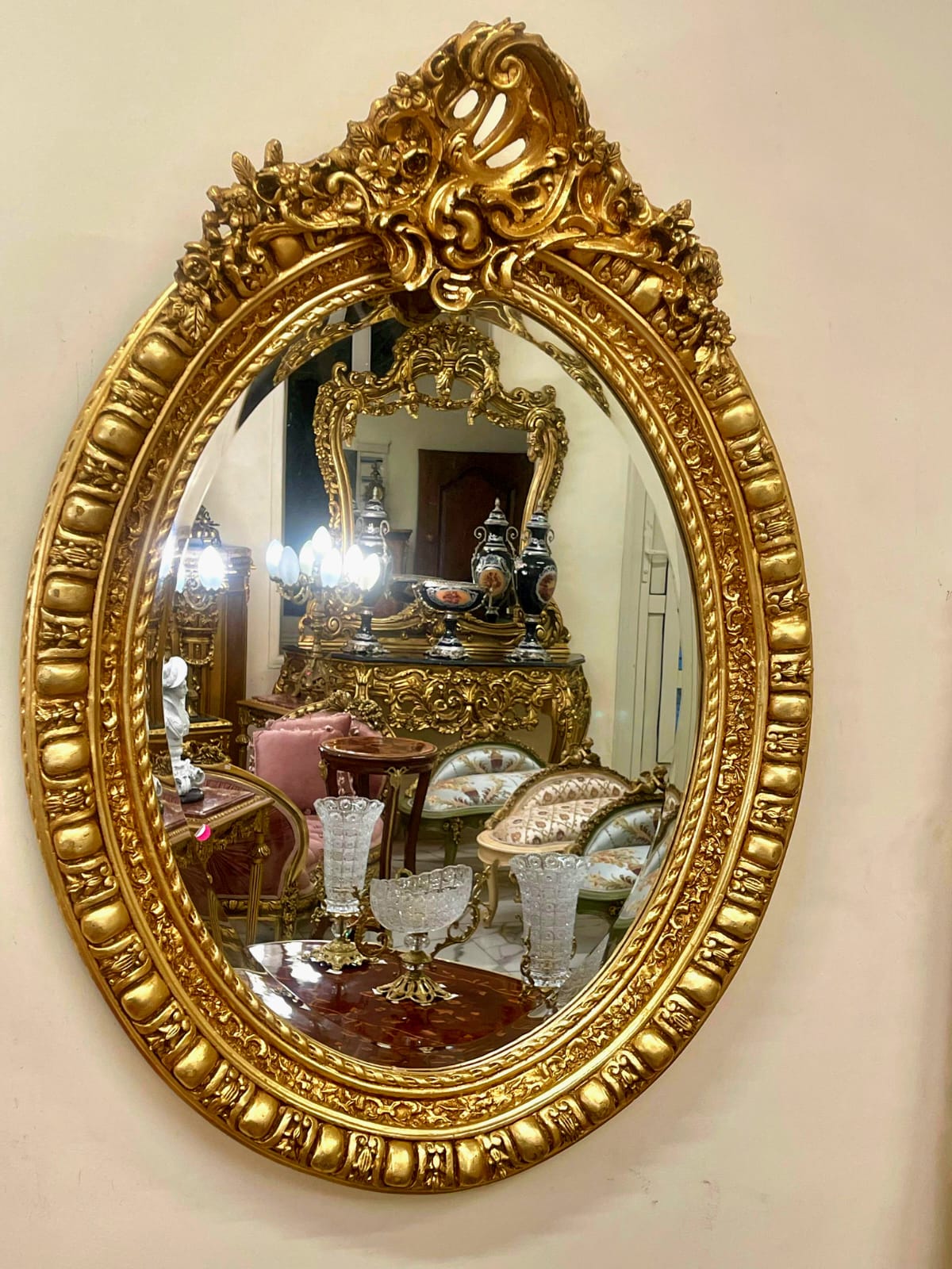 Italian Oval Wall Mirror with Floral Center Detail & Gold Leaf Frame