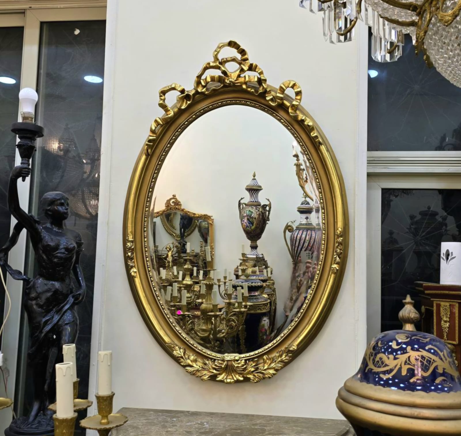 Oval Wall Mirror – Hand Carved Gold Leaf Frame with Ribbon Crest Detail