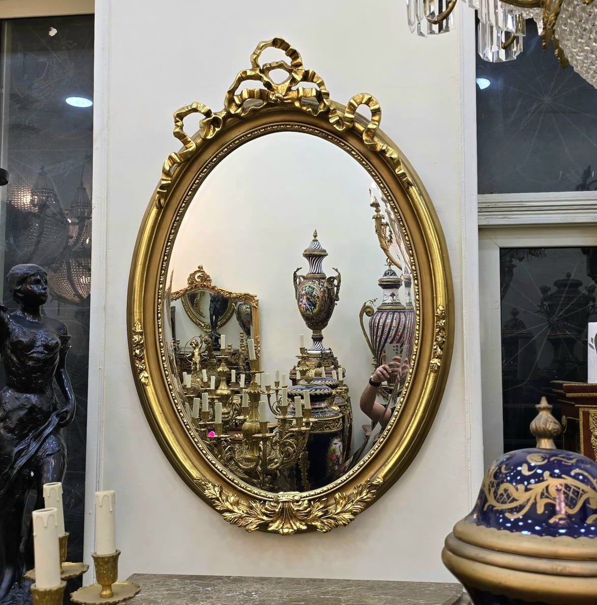 Oval Wall Mirror – Hand Carved Gold Leaf Frame with Ribbon Crest Detail
