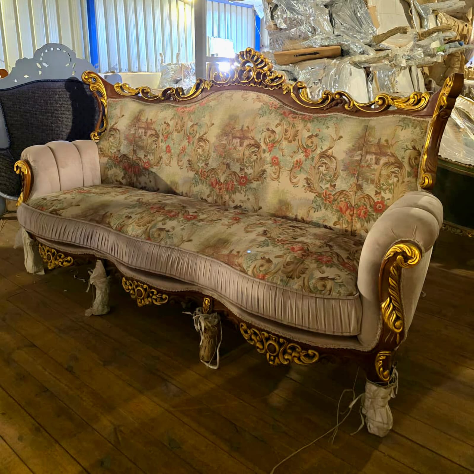 French Rococo Three-Seat Sofa with Floral Upholstery & Ornate Gold Leaf Carvings