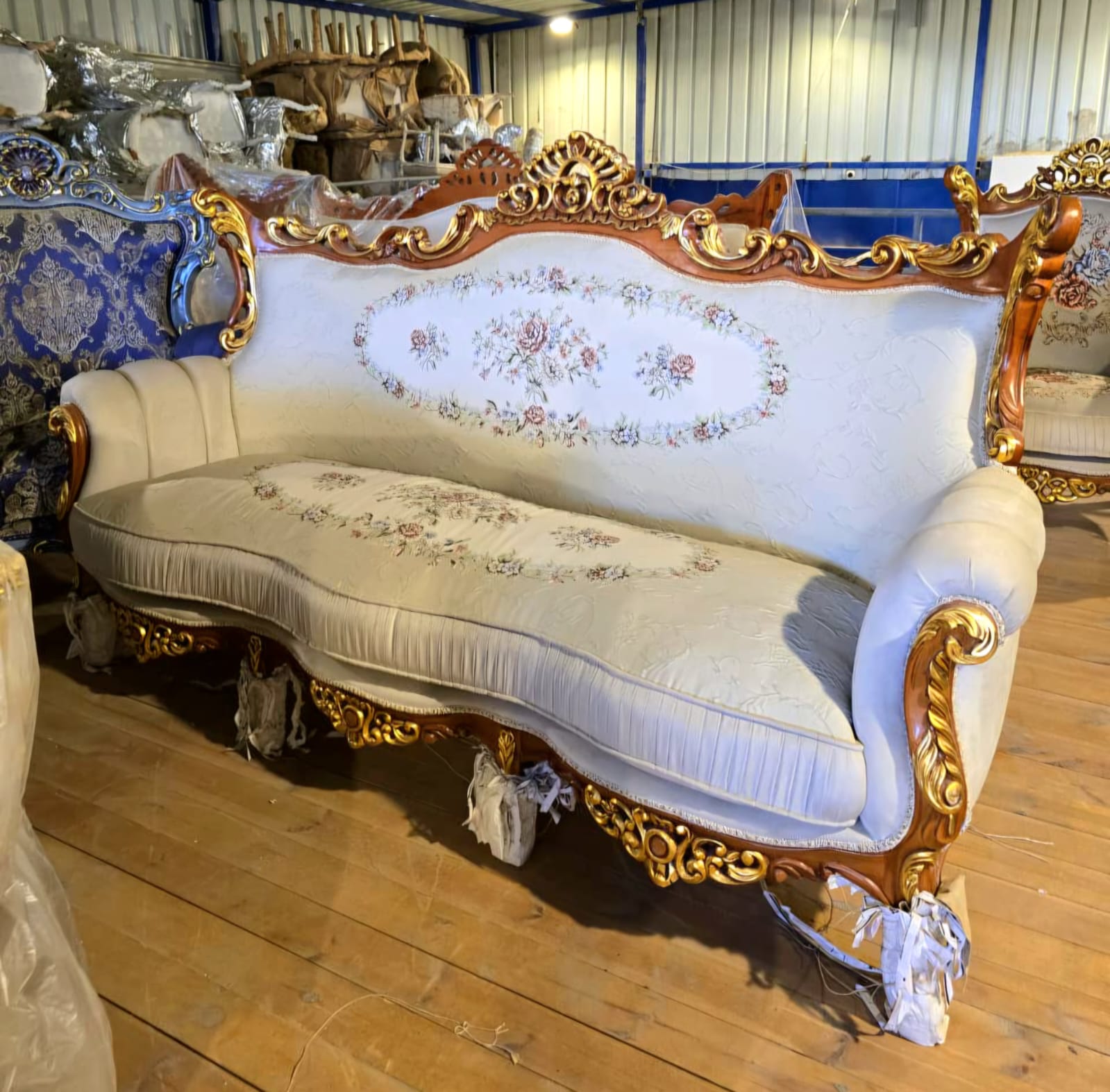 Grand French Louis XV Three-Seat Sofa with Floral Upholstery & Hand-Carved Gold Leaf Frame