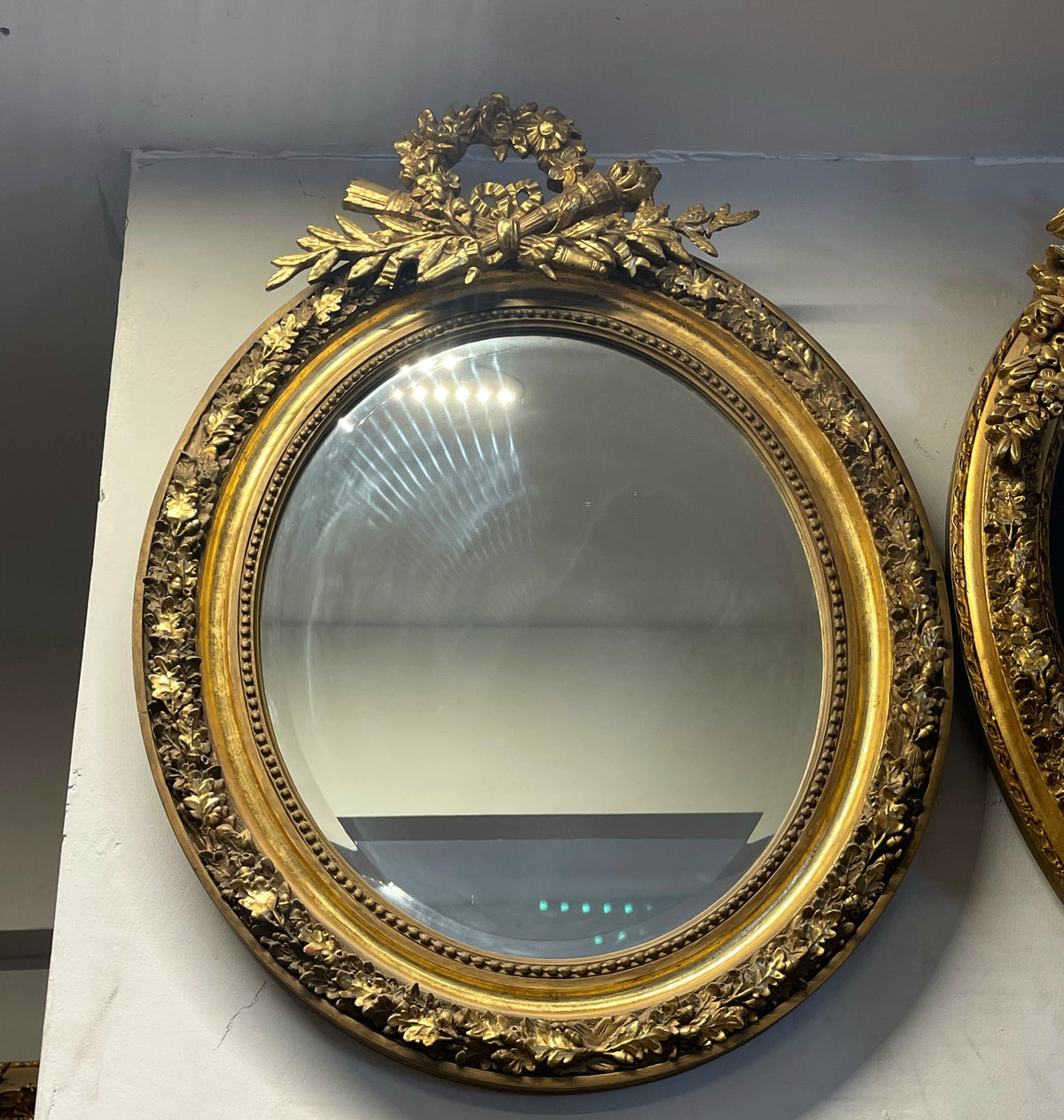 French-Inspired Oval Wall Mirror – Ornate Gold Leaf Frame with Sculpted Laurel Wreath Crest